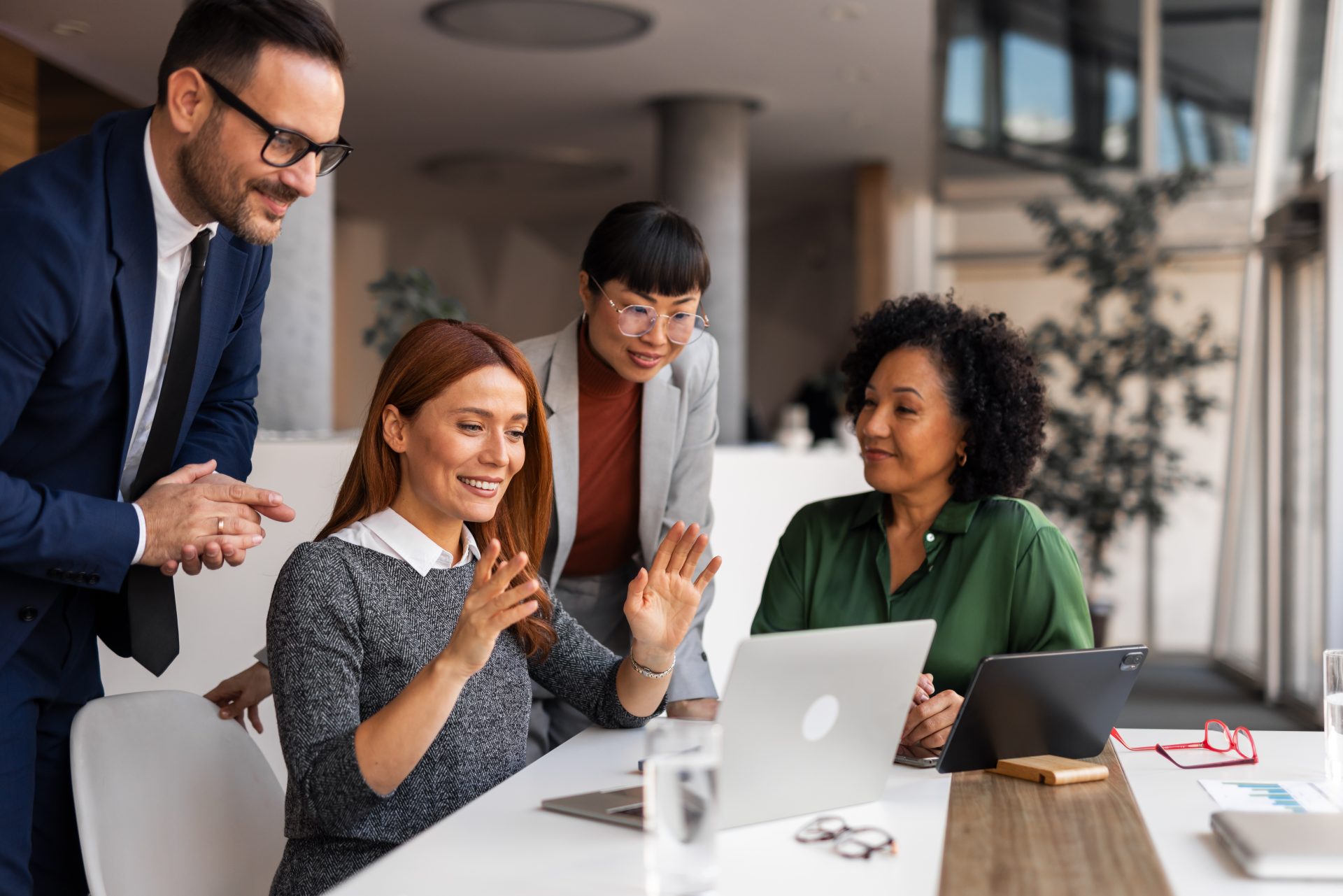 People working together in a team meeting.,